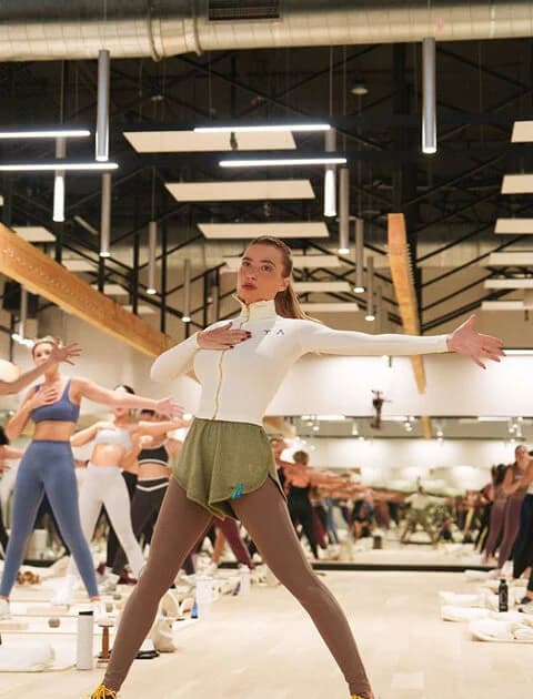 A packed group class at a Tracy Anderson studio, everyone moving in unison
